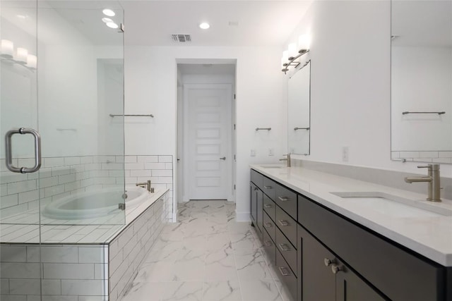 4703 Unity Cir Unit 284, Austin, TX 78731 - full bath with double vanity, marble finish floors, a bath, and recessed lighting