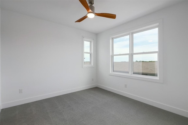 4703 Unity Cir Unit 284, Austin, TX 78731 - unfurnished room featuring baseboards, dark colored carpet, and ceiling fan