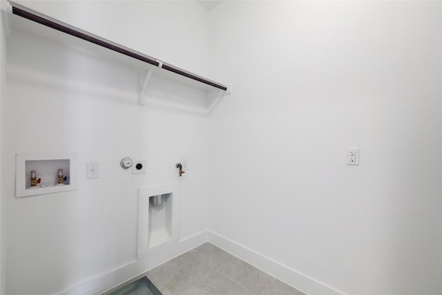 4703 Unity Cir Unit 284, Austin, TX 78731 - laundry room featuring hookup for a gas dryer, hookup for a washing machine, baseboards, electric dryer hookup, and light tile patterned floors