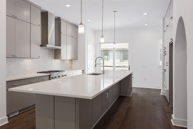 4703 Unity Cir Unit 284, Austin, TX 78731 - kitchen with a sink, wall chimney exhaust hood, gray cabinets, backsplash, and dark wood-style floors