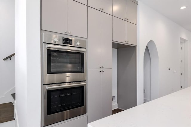 4703 Unity Cir Unit 284, Austin, TX 78731 - kitchen featuring double oven, recessed lighting, and light stone countertops