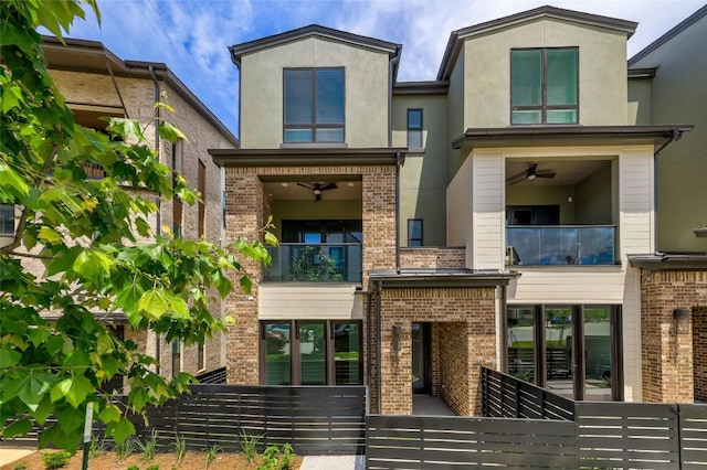 4703 Unity Cir Unit 284, Austin, TX 78731 - view of front of house with brick siding, a balcony, and stucco siding