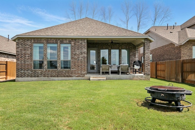 112 Rosemary Ct, Bastrop, TX 78602 - back of house featuring brick siding, a fire pit, a patio area, a shingled roof, and ceiling fan