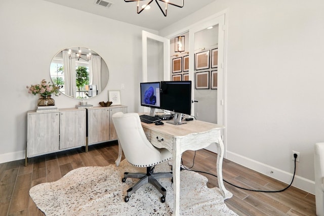 112 Rosemary Ct, Bastrop, TX 78602 - home office with a chandelier, baseboards, and wood finished floors