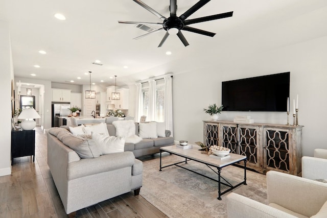 112 Rosemary Ct, Bastrop, TX 78602 - living room with ceiling fan, wood finished floors, and recessed lighting