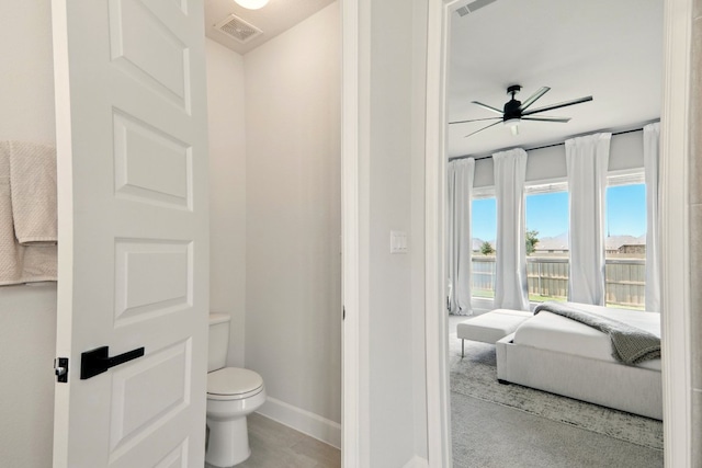 112 Rosemary Ct, Bastrop, TX 78602 - bathroom with toilet, baseboards, and ceiling fan