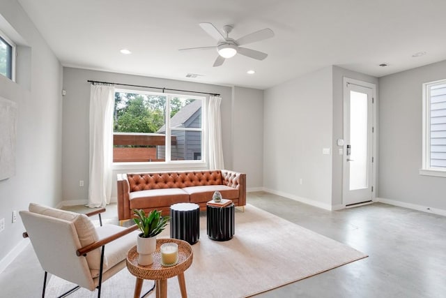 4020 Airport Blvd Unit 9, Austin, TX 78722 - living room with healthy amount of natural light, baseboards, finished concrete flooring, ceiling fan, and recessed lighting