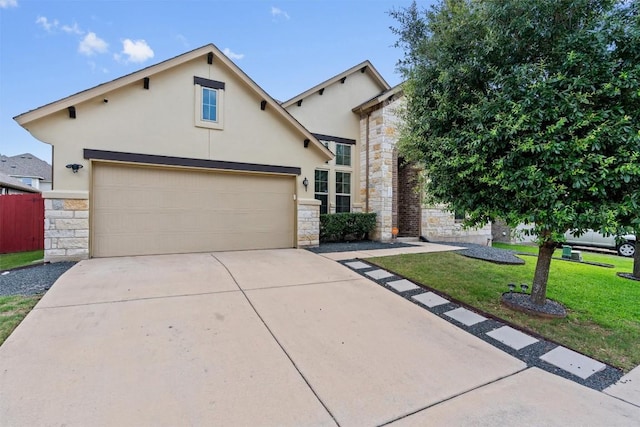13708 Field Stream Ln, Manor, TX 78653 - view of front of house featuring stone siding, stucco siding, and driveway