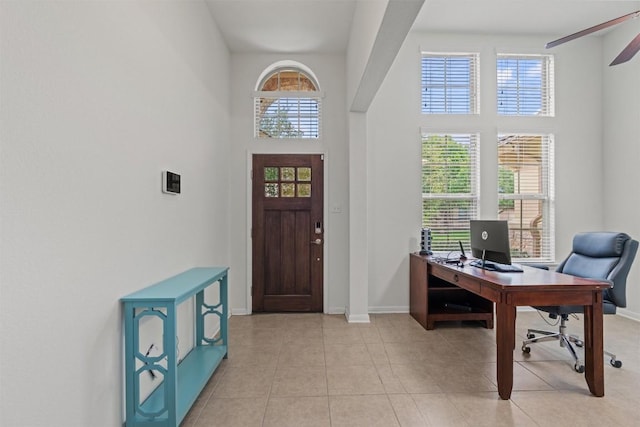 13708 Field Stream Ln, Manor, TX 78653 - foyer with a towering ceiling, baseboards, and light tile patterned flooring