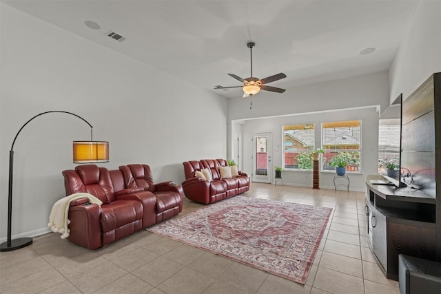 13708 Field Stream Ln, Manor, TX 78653 - living room with ceiling fan, light tile patterned floors, and baseboards
