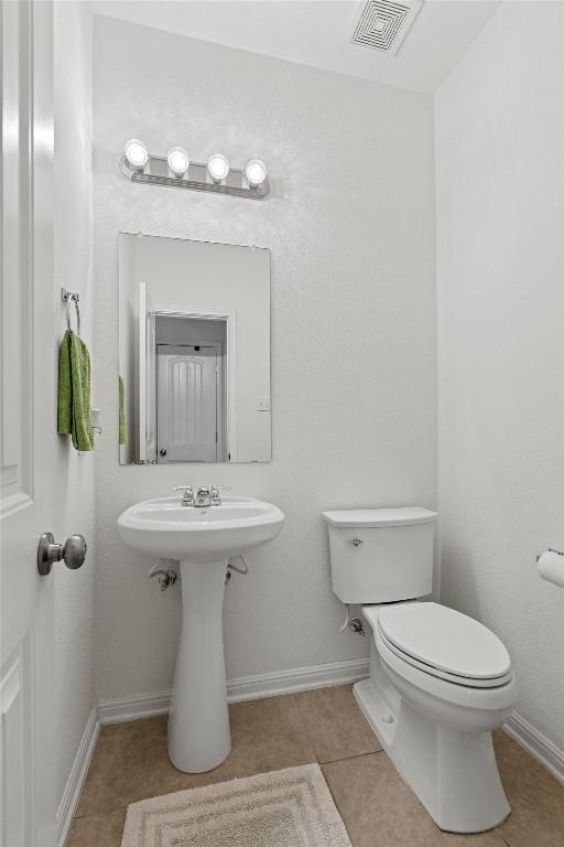 13708 Field Stream Ln, Manor, TX 78653 - bathroom with toilet, tile patterned floors, and baseboards