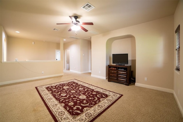 11925 Timber Heights Dr, Austin, TX 78754 - carpeted living room with a ceiling fan, baseboards, arched walkways, and recessed lighting
