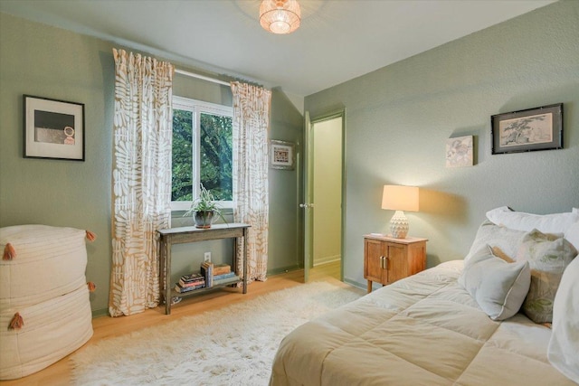 1704 Prairie Hen Cv, Austin, TX 78758 - bedroom featuring wood finished floors
