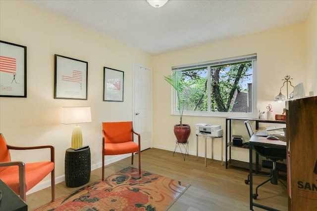 1704 Prairie Hen Cv, Austin, TX 78758 - living area with an office area and wood finished floors