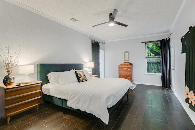 1704 Prairie Hen Cv, Austin, TX 78758 - bedroom with a textured ceiling, wood finished floors, ornamental molding, and ceiling fan