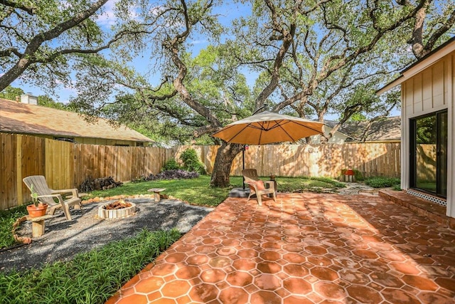 1704 Prairie Hen Cv, Austin, TX 78758 - fenced backyard featuring a fire pit and a patio