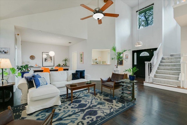 1704 Prairie Hen Cv, Austin, TX 78758 - living area featuring high vaulted ceiling, wood finished floors, a ceiling fan, and stairway