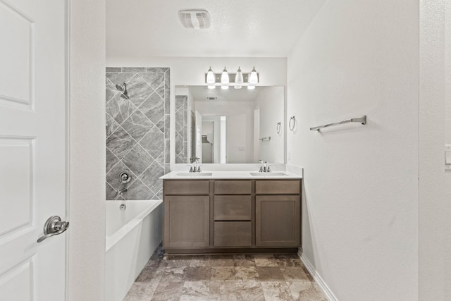 18517 Spotted Eagle Ln, Elgin, TX 78621 - bathroom featuring double vanity and washtub / shower combination