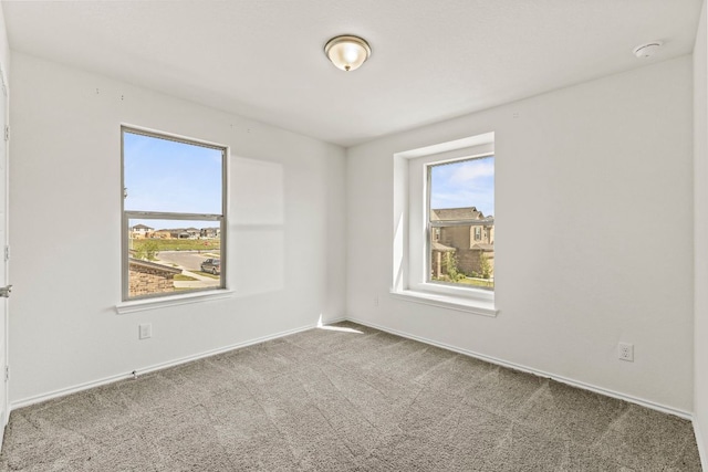18517 Spotted Eagle Ln, Elgin, TX 78621 - carpeted spare room featuring baseboards and a smoke detector