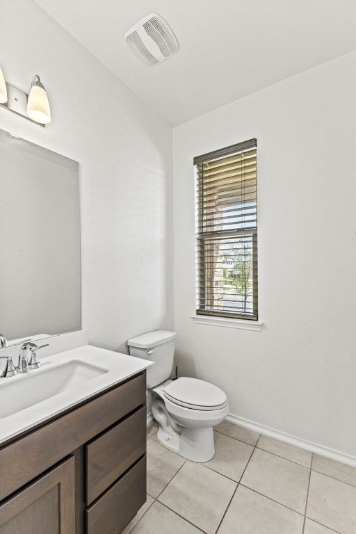 18517 Spotted Eagle Ln, Elgin, TX 78621 - half bathroom featuring vanity and tile patterned flooring