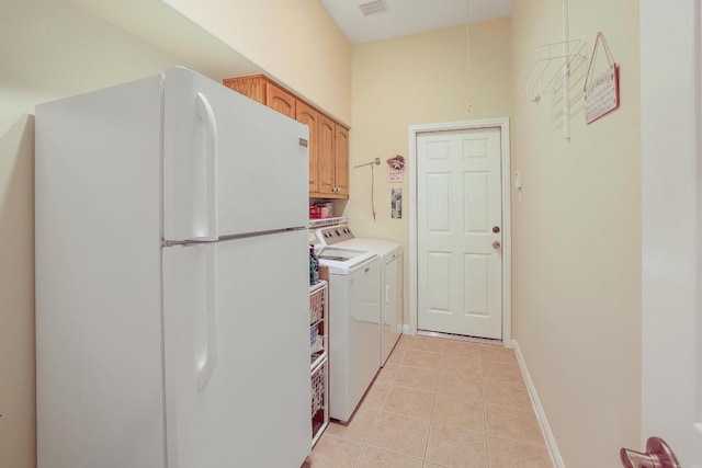 2517 Moray Ln, Cedar Park, TX 78613 - laundry room featuring washing machine and clothes dryer, light tile patterned floors, cabinet space, and baseboards