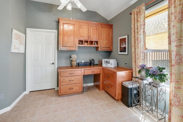 2517 Moray Ln, Cedar Park, TX 78613 - office area featuring built in study area, vaulted ceiling, ceiling fan, light tile patterned floors, and baseboards