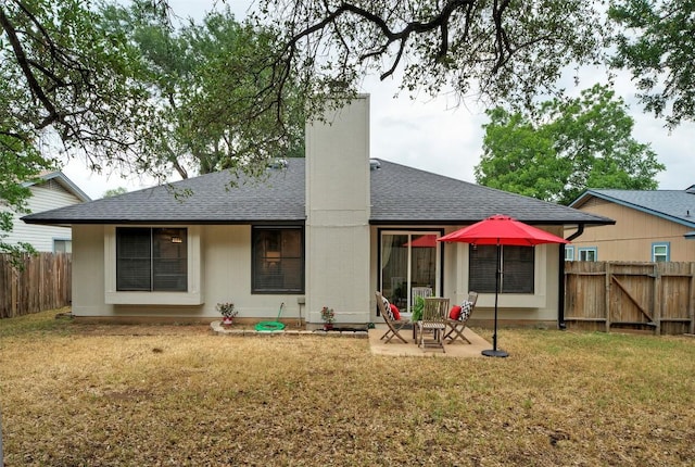 615 Twin Oak Trl, Cedar Park, TX 78613 - back of property with a fenced backyard, a patio, roof with shingles, and a chimney