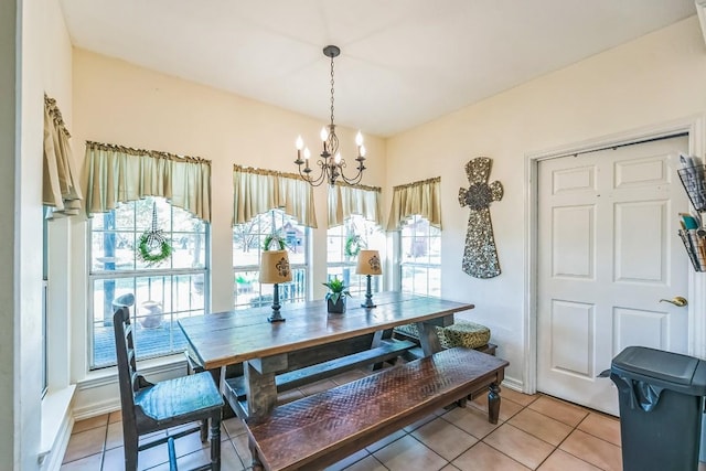 909 Oak Meadow Dr, Dripping Springs, TX 78620 - dining area with healthy amount of natural light, a chandelier, and light tile patterned flooring