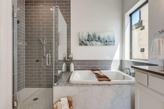 6833 Destination Way, Lago Vista, TX 78645 - bathroom with a garden tub, a stall shower, and vanity