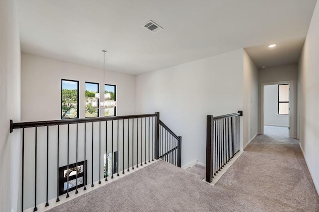 6833 Destination Way, Lago Vista, TX 78645 - hallway with an upstairs landing, carpet, and recessed lighting