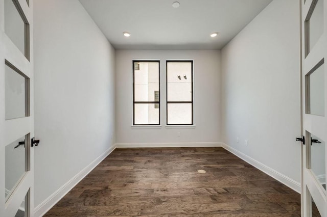 6833 Destination Way, Lago Vista, TX 78645 - empty room with dark wood-style floors and recessed lighting