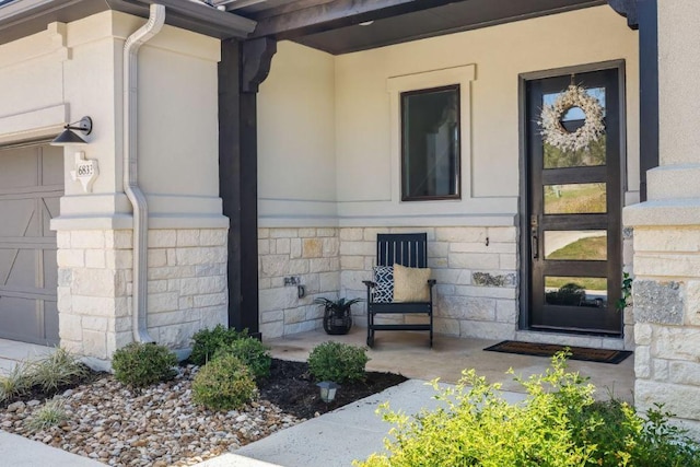 6833 Destination Way, Lago Vista, TX 78645 - view of exterior entry with covered porch, stone siding, and stucco siding