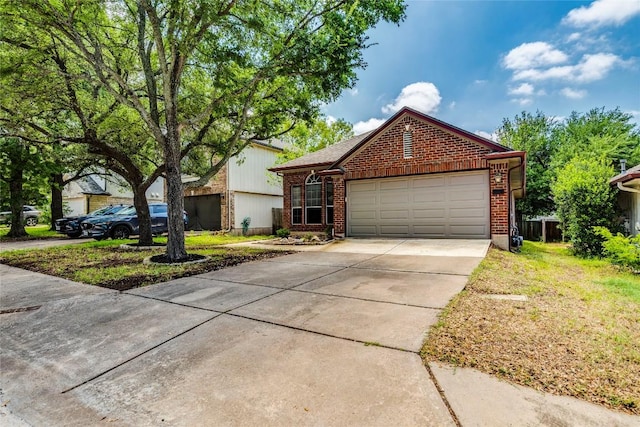 14710 Montoro Dr, Austin, TX 78728 - view of front of property with brick siding, a garage, and concrete driveway