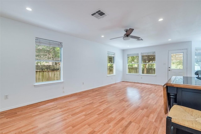 14710 Montoro Dr, Austin, TX 78728 - unfurnished living room with light wood-style flooring, a ceiling fan, recessed lighting, and baseboards