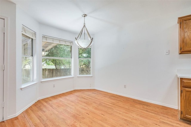 14710 Montoro Dr, Austin, TX 78728 - unfurnished dining area featuring light wood-style floors and baseboards