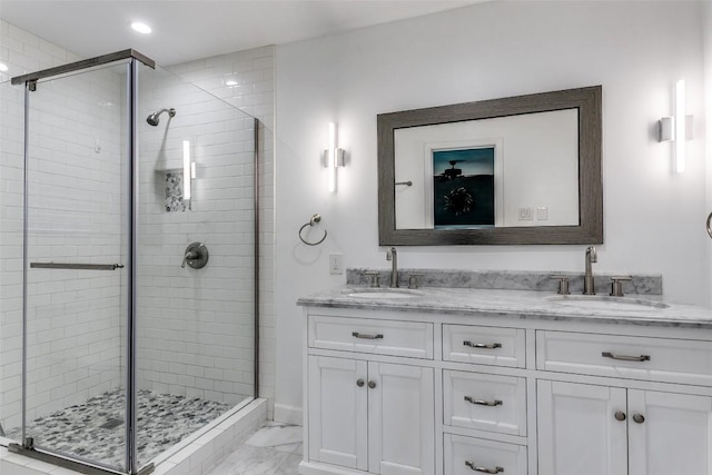 110 Fleetwood Dr, New Braunfels, TX 78130 - bathroom with marble finish flooring, a stall shower, double vanity, and recessed lighting