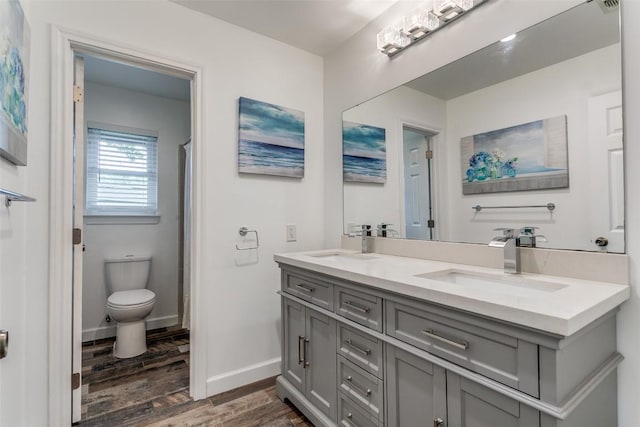 110 Fleetwood Dr, New Braunfels, TX 78130 - bathroom featuring double vanity, wood finished floors, and a shower with shower curtain