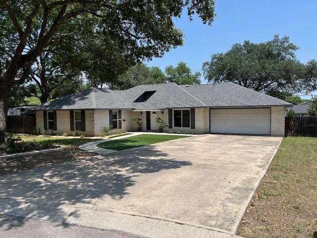 110 Fleetwood Dr, New Braunfels, TX 78130 - ranch-style house featuring driveway, brick siding, an attached garage, and roof with shingles