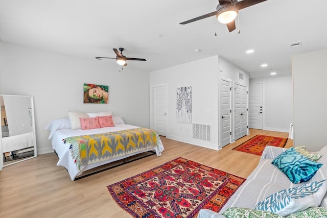2500 Longview St Unit 112, Austin, TX 78705 - bedroom featuring wood finished floors, baseboards, recessed lighting, and a ceiling fan