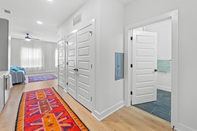 2500 Longview St Unit 112, Austin, TX 78705 - corridor with electric panel, recessed lighting, light wood-style floors, and baseboards