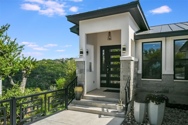 105 Golden Eagle, Horseshoe Bay, TX 78657 - entrance to property with stucco siding, a standing seam roof, a balcony, and metal roof