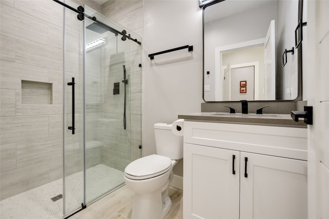 105 Golden Eagle, Horseshoe Bay, TX 78657 - bathroom featuring toilet, vanity, and a stall shower