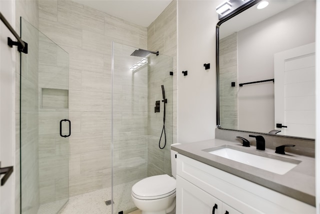 105 Golden Eagle, Horseshoe Bay, TX 78657 - bathroom featuring toilet, vanity, and a stall shower