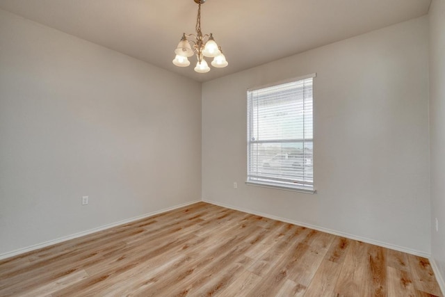9104 China Rose Dr, Austin, TX 78724 - unfurnished room with a chandelier and light wood-type flooring