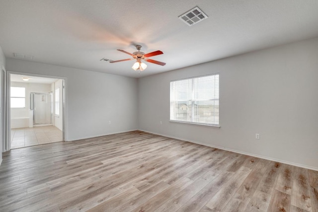 9104 China Rose Dr, Austin, TX 78724 - unfurnished room with ceiling fan and light wood finished floors