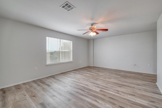 9104 China Rose Dr, Austin, TX 78724 - spare room with a ceiling fan and light wood-style floors