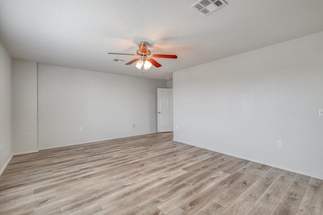9104 China Rose Dr, Austin, TX 78724 - spare room with ceiling fan and light wood-style floors