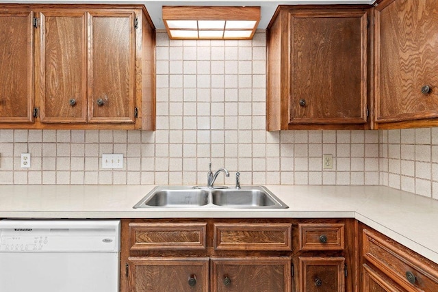302 Council Rd, Georgetown, TX 78633 - kitchen featuring white dishwasher, a sink, decorative backsplash, and light countertops
