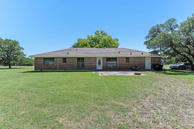 302 Council Rd, Georgetown, TX 78633 - back of property featuring a patio and a lawn