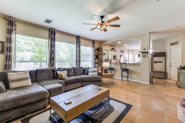 1433 Jenna Ln, Cedar Park, TX 78613 - living room featuring arched walkways, ceiling fan, and healthy amount of natural light